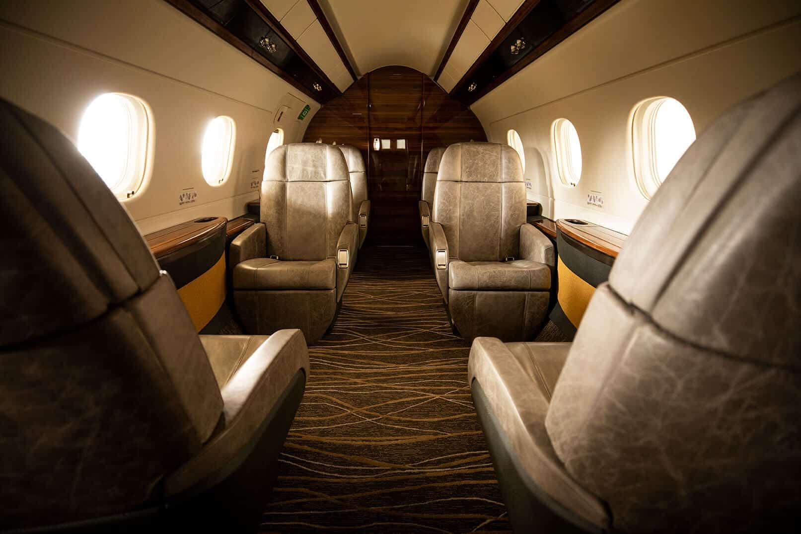 Chestnut, Flexjet, private jet, Legacy 450, jet interior, midsize, super midsize, mid cabin, seating view, mid cabin view, Embraer