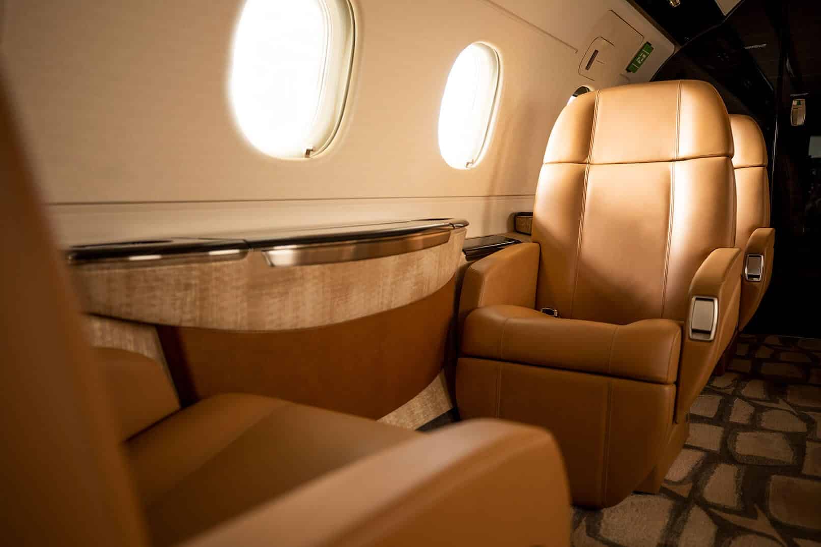 Flexjet, private jet, Legacy 450, jet interior, midsize, super midsize, mid cabin, Dakota, Embraer, LXi Cabin Collection, seats, leather seating, captains chairs