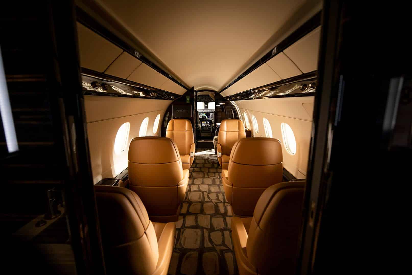 Flexjet, private jet, Legacy 450, jet interior, midsize, super midsize, mid cabin, Dakota, LXi Cabin Collection, Embraer, seating view
